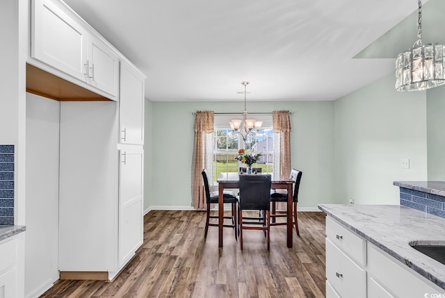 206 Balsa Dr, Longs, SC 29568 - dining space featuring a chandelier and dark wood finished floors