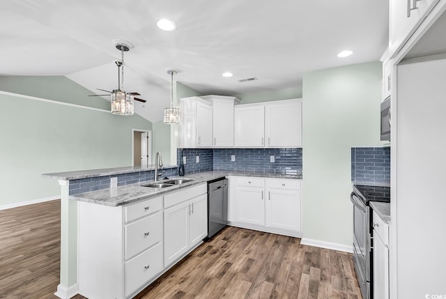 206 Balsa Dr, Longs, SC 29568 - kitchen featuring appliances with stainless steel finishes, a ceiling fan, a peninsula, white cabinetry, and wood finished floors