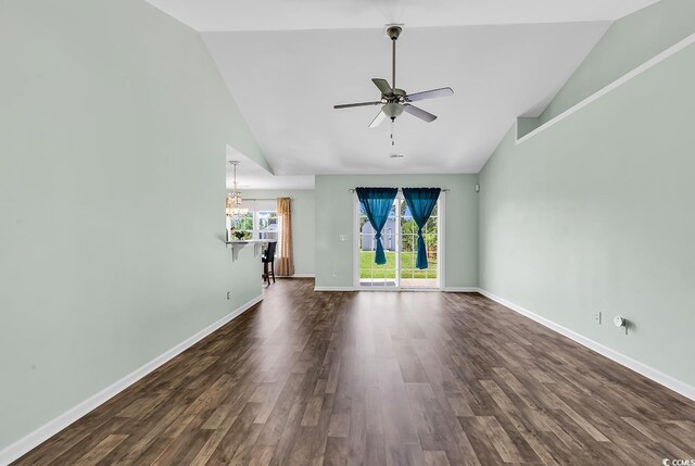 206 Balsa Dr, Longs, SC 29568 - unfurnished living room with high vaulted ceiling, ceiling fan, dark wood-type flooring, and a chandelier