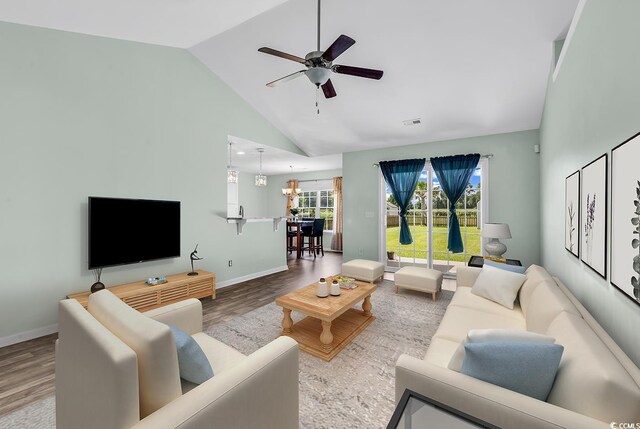 206 Balsa Dr, Longs, SC 29568 - living room featuring lofted ceiling, a ceiling fan, and wood finished floors