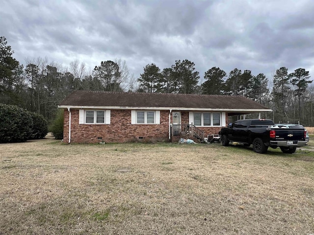 single story home featuring brick siding, crawl space, and a front yard