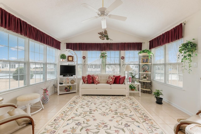 sunroom / solarium with a ceiling fan and lofted ceiling