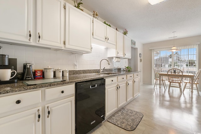 kitchen with a textured ceiling, a sink, white cabinets, black dishwasher, and tasteful backsplash