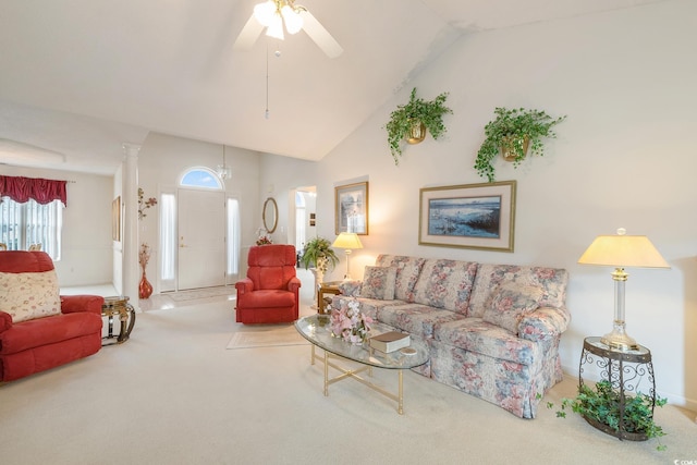 living area with carpet floors, high vaulted ceiling, a ceiling fan, and ornate columns