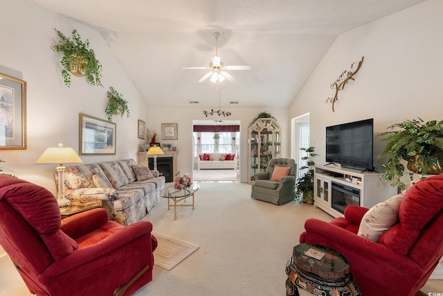 living room with carpet, a fireplace, high vaulted ceiling, and ceiling fan