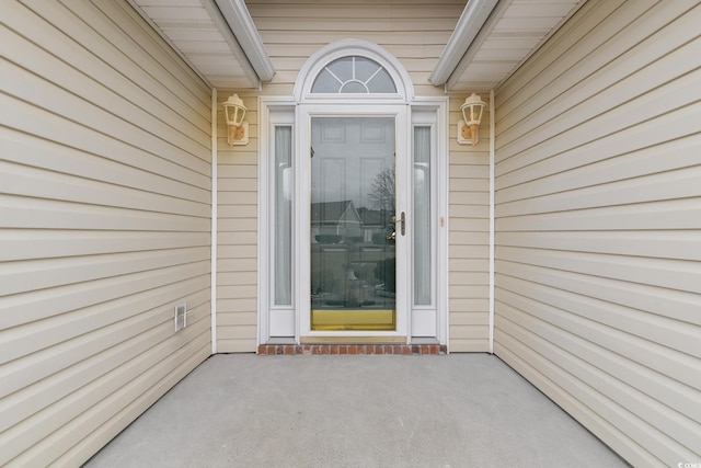 property entrance with a patio