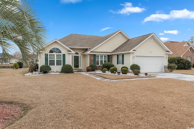 ranch-style house with driveway, brick siding, a shingled roof, an attached garage, and a front yard