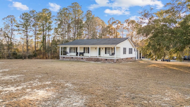 view of front of house with crawl space and a porch