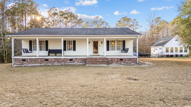 view of front of home featuring a porch and roof with shingles