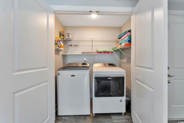 laundry room with laundry area and washing machine and clothes dryer