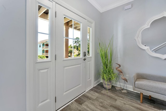 entryway with crown molding, baseboards, and wood finished floors