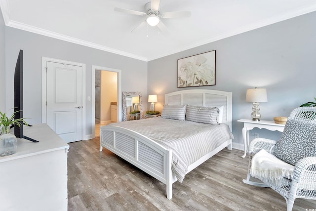 bedroom with ornamental molding, wood finished floors, a ceiling fan, and baseboards