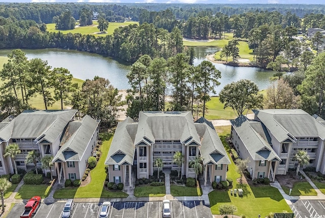 birds eye view of property featuring a water view and a residential view