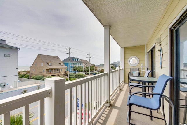 balcony with a residential view and a sunroom