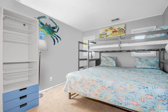 bedroom with visible vents, baseboards, and light colored carpet