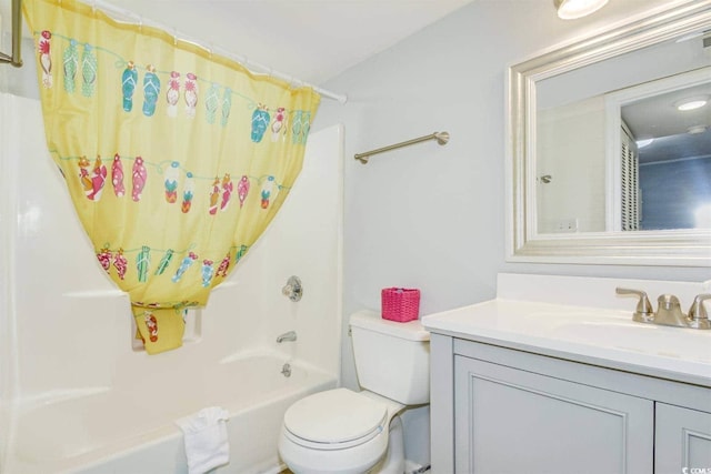 full bathroom with toilet, vanity, and shower / bath combo