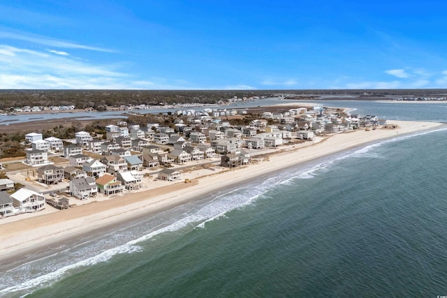 bird's eye view with a residential view, a view of the beach, and a water view