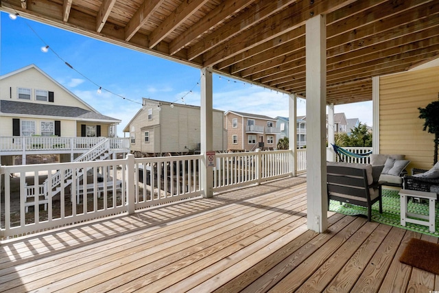 wooden terrace with a residential view