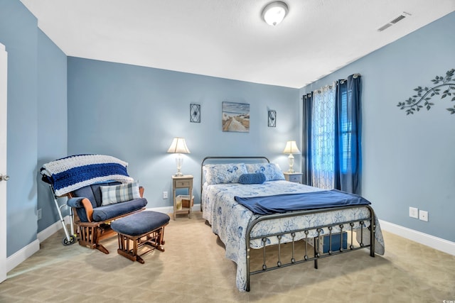 bedroom with carpet, baseboards, and visible vents