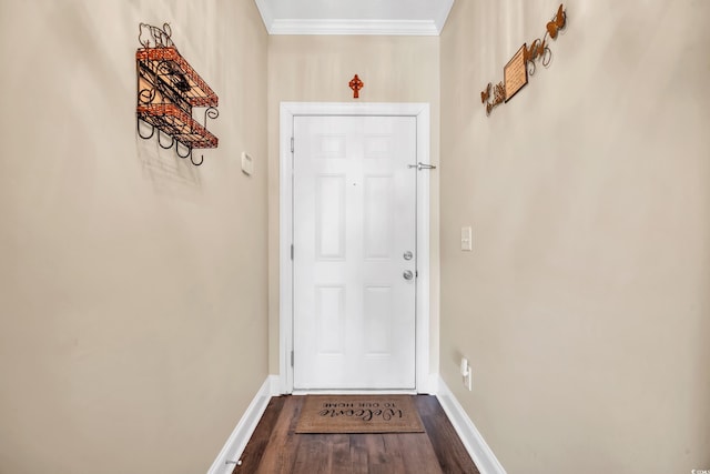 entryway featuring baseboards, dark wood-type flooring, and crown molding