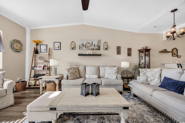 living area featuring vaulted ceiling, ornate columns, dark wood-type flooring, and crown molding