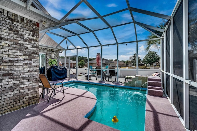 view of pool featuring a fenced in pool, glass enclosure, and a patio