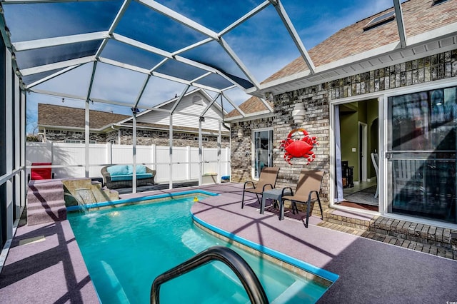 view of swimming pool with a fenced in pool, a lanai, a patio, and fence