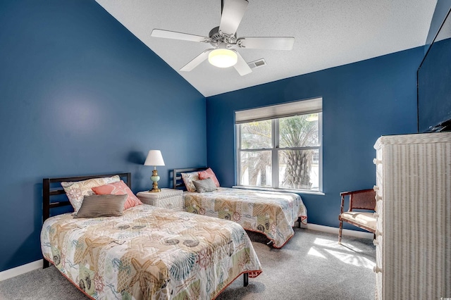 carpeted bedroom with visible vents, vaulted ceiling, a textured ceiling, ceiling fan, and baseboards