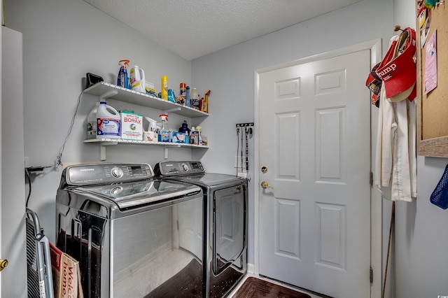 laundry room featuring a textured ceiling, laundry area, and independent washer and dryer