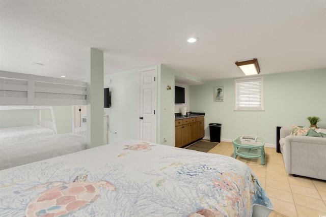 bedroom featuring light tile patterned flooring, recessed lighting, and baseboards