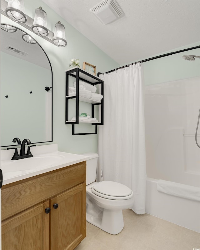 bathroom featuring visible vents, toilet, vanity, and shower / bath combo