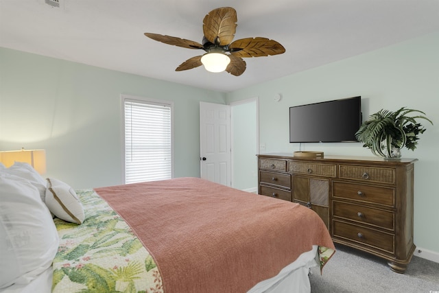 bedroom with carpet flooring, ceiling fan, and baseboards