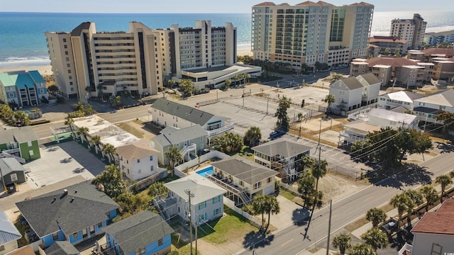 drone / aerial view with a city view and a water view