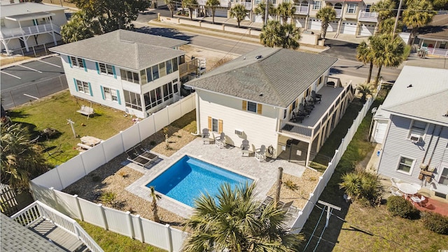 exterior space with a patio, a fenced backyard, and a residential view