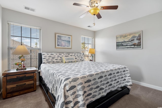 bedroom with a ceiling fan, baseboards, visible vents, and carpet flooring