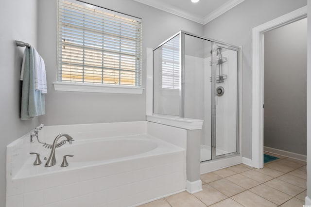 bathroom with a garden tub, crown molding, a shower stall, and tile patterned floors