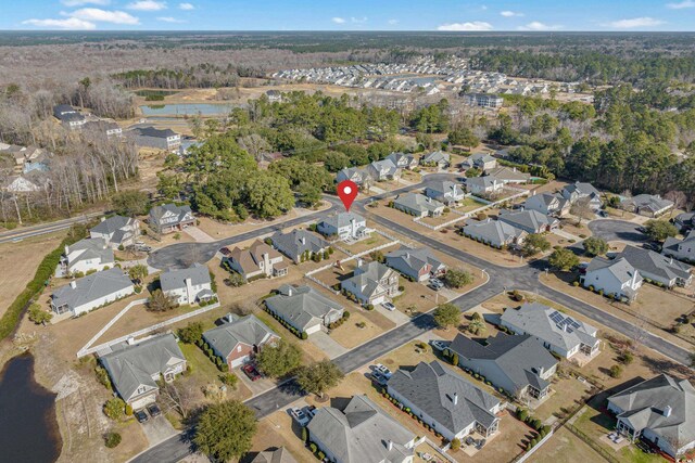 aerial view with a water view and a residential view