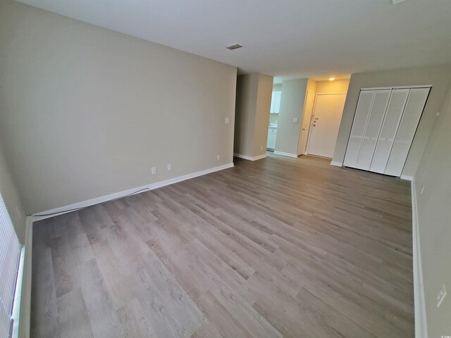 6840 Blue Heron Blvd Unit 108, Myrtle Beach, SC 29588 - unfurnished bedroom featuring wood finished floors and baseboards