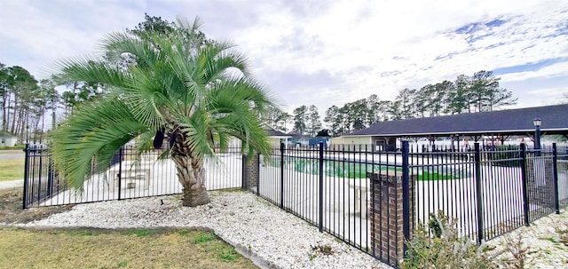 community pool featuring fence