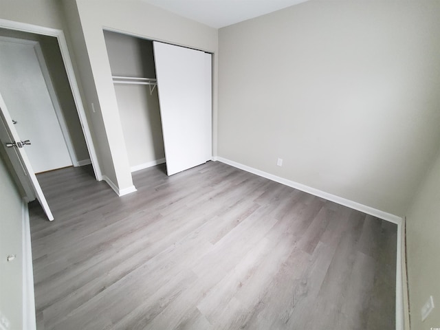 6840 Blue Heron Blvd Unit 108, Myrtle Beach, SC 29588 - unfurnished bedroom featuring wood finished floors and a closet
