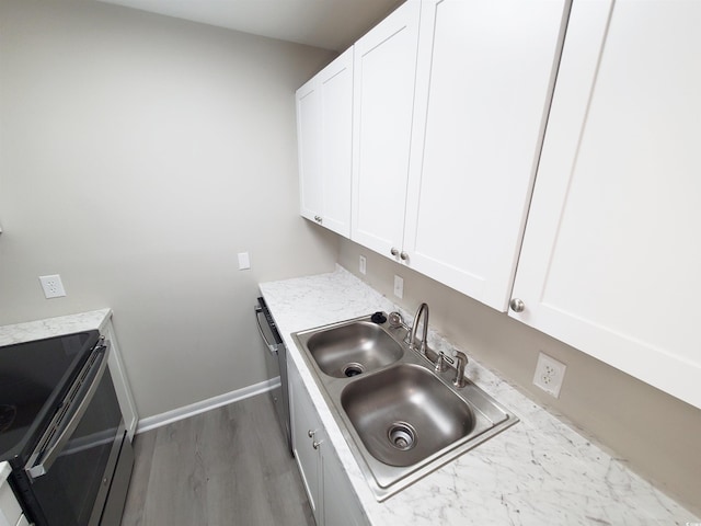 6840 Blue Heron Blvd Unit 108, Myrtle Beach, SC 29588 - laundry room with a sink and wood finished floors
