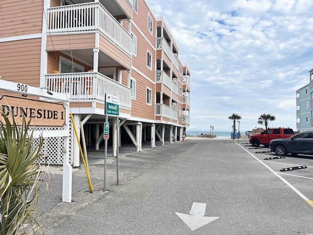 view of building exterior featuring covered parking