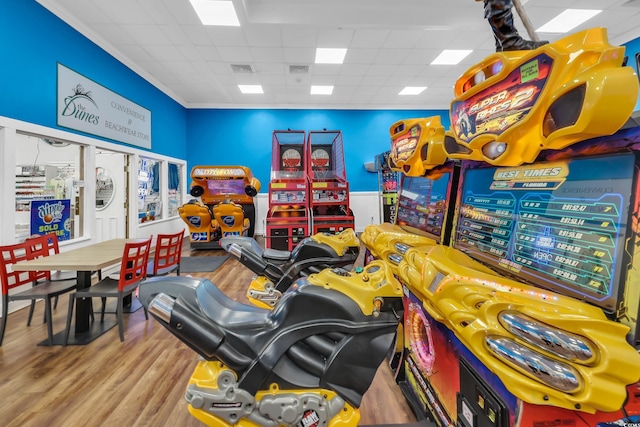 game room with visible vents, a paneled ceiling, and wood finished floors