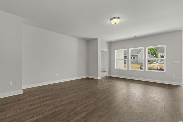 1204 NW Calabash Station Blvd, Calabash, NC 28467 - empty room featuring dark wood-style flooring and baseboards