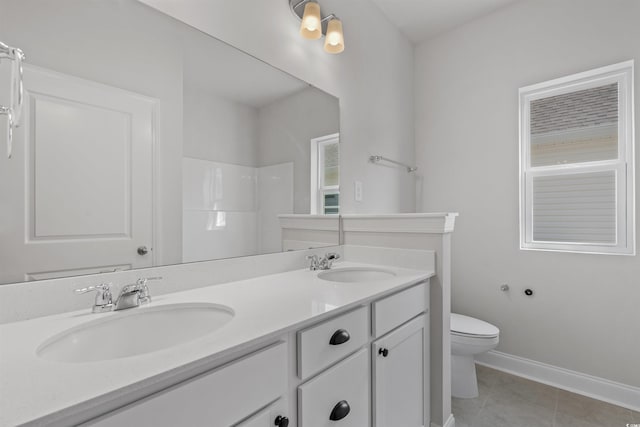 1204 NW Calabash Station Blvd, Calabash, NC 28467 - bathroom with double vanity, toilet, tile patterned flooring, and a sink