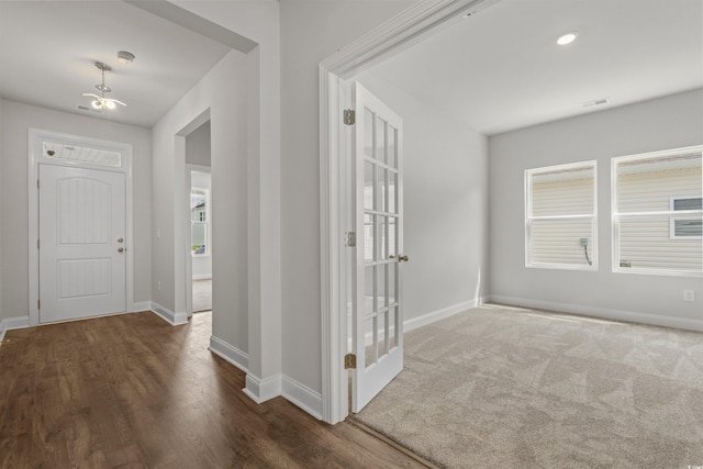 1204 NW Calabash Station Blvd, Calabash, NC 28467 - entryway with wood finished floors, visible vents, and baseboards
