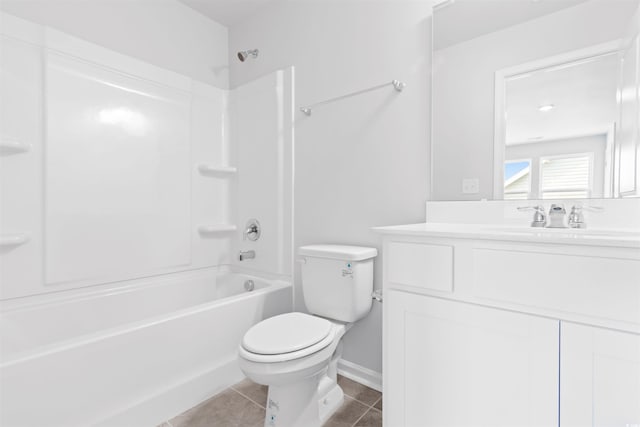 full bath with toilet, vanity, baseboards, tub / shower combination, and tile patterned floors