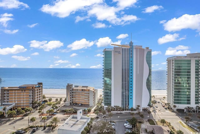 bird's eye view featuring a water view and a city view