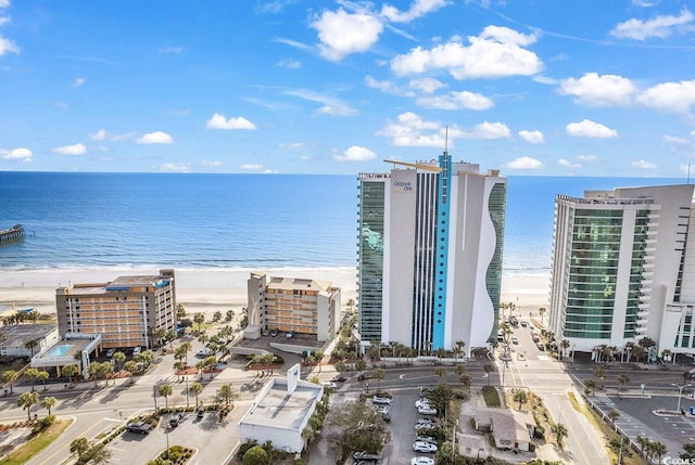 birds eye view of property featuring a view of city and a water view