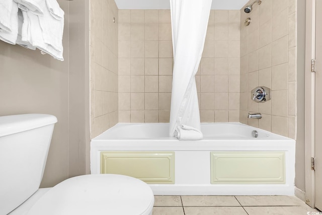 bathroom with tile patterned flooring, shower / bath combination with curtain, and toilet